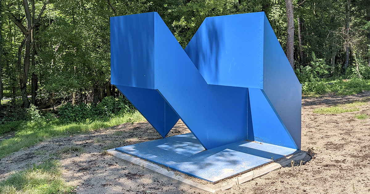 large blue geometric metal sculpture