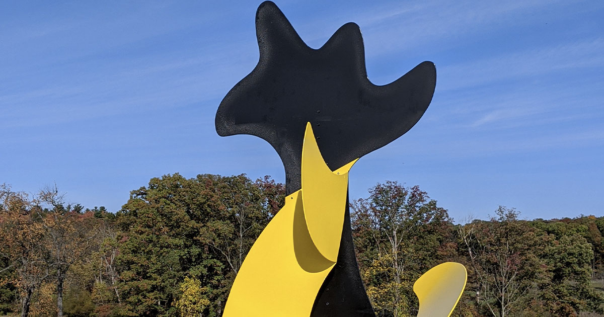 large yellow and metal sculpture