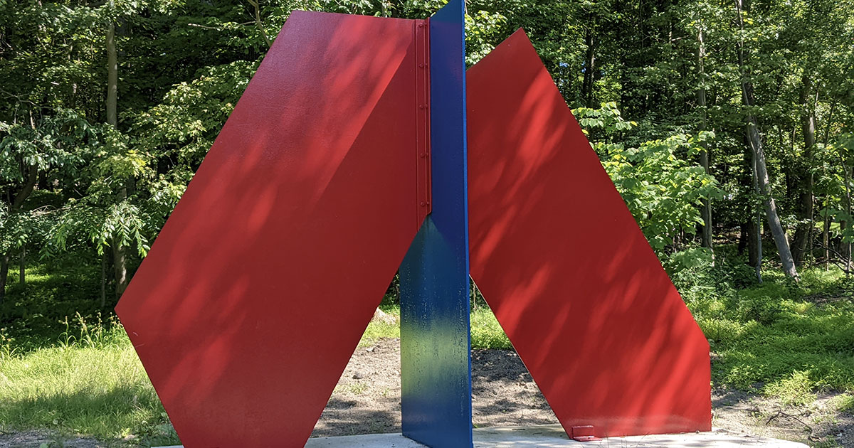 large red and blue metal sculpture