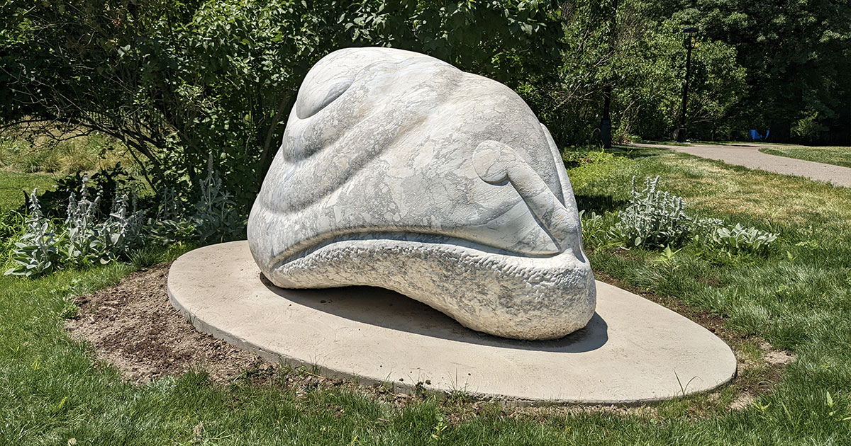 large marble sculpture that looks like a snail