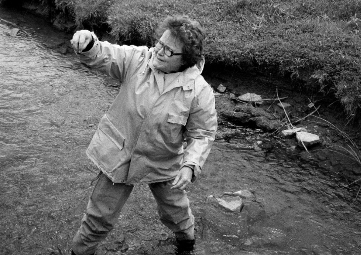 Dr. Ruth Patrick taking a ecological sample in a creek