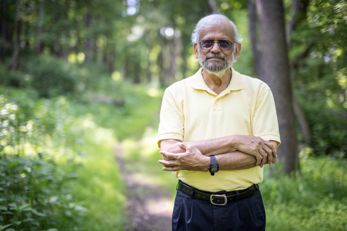 Man standing on a trail in the park